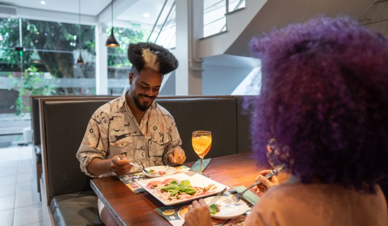 Satisfied diner at a Medellín restaurant