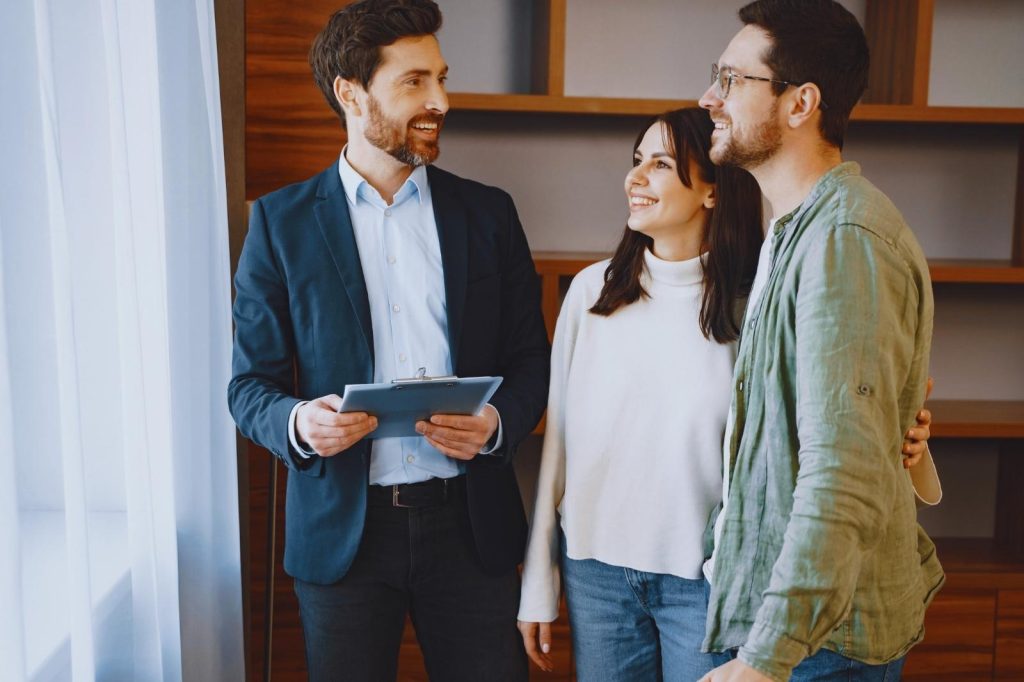 Realtor showing a house to a couple.
